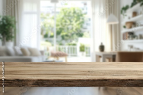 Wooden tabletop with blurred background of a living room interior with white curtains, a sofa, and green plants.