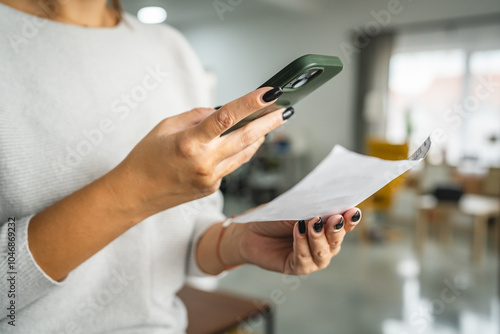 woman do contactleess payment on cellphone and pay bills