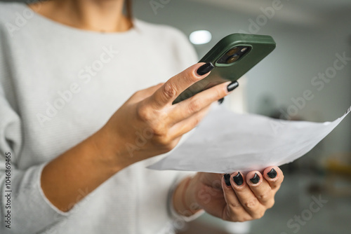 woman do contactleess payment on cellphone and pay bills