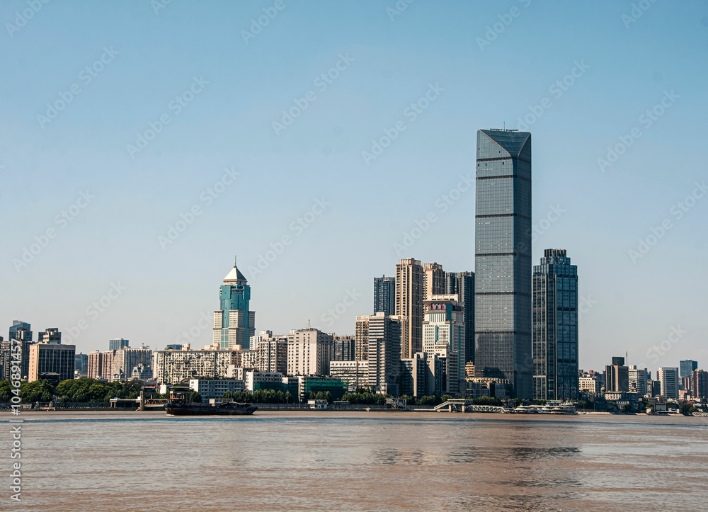 Naklejka premium Modern skyscrapes along the Yangtze River in Wuhan, China