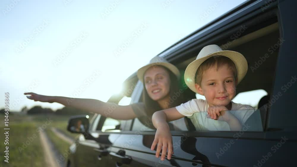 Happy kids enjoy family car adventure. Siblings in hats lean out car window, excited for journey. Happy Kids embrace freedom on family car adventure. Family car adventure creates lasting memories. Happy kids enjoy family car adventure. Siblings in hats lean out car window, excited for journey. Happy Kids embrace freedom on family car adventure. Family car adventure creates lasting memories.