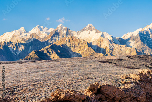 Gravel road square and snow mountain nature landscape at sunset. car background.