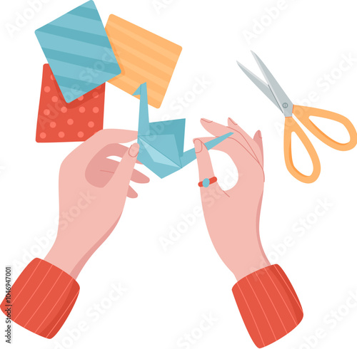 Hands working with colorful paper and scissors to create origami figures. Engaging activity for children, emphasizing DIY craftwork and creativity. Concept of fun, art, workshop activities.