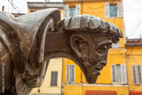  Bronze statue of Father Lino, prominently located in the historic center of Parma, showcasing local heritage photo