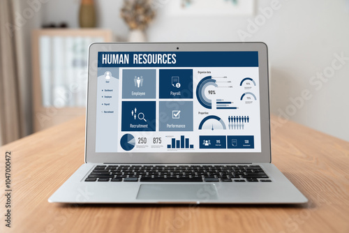 Human resources management software on computer screen helping human resources employee to manage recruitment, payroll, staff searching and KPI evaluation snugly