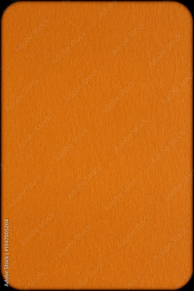 Fototapeta premium background for Halloween: close up of orange color textured cardboard shadowed at edges