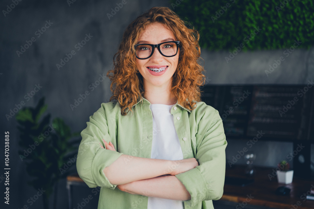 Photo of confident positive lady programmer dressed shirt glasses arms crossed indoors workplace workstation loft Photo of confident positive lady programmer dressed shirt glasses arms crossed indoors workplace workstation loft