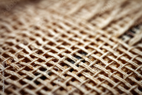 Extreme closeup of an old book from the side. Selective soft focus, shallow depth of field. Bibliophile, bookworm abstract background. Book binding detail. photo