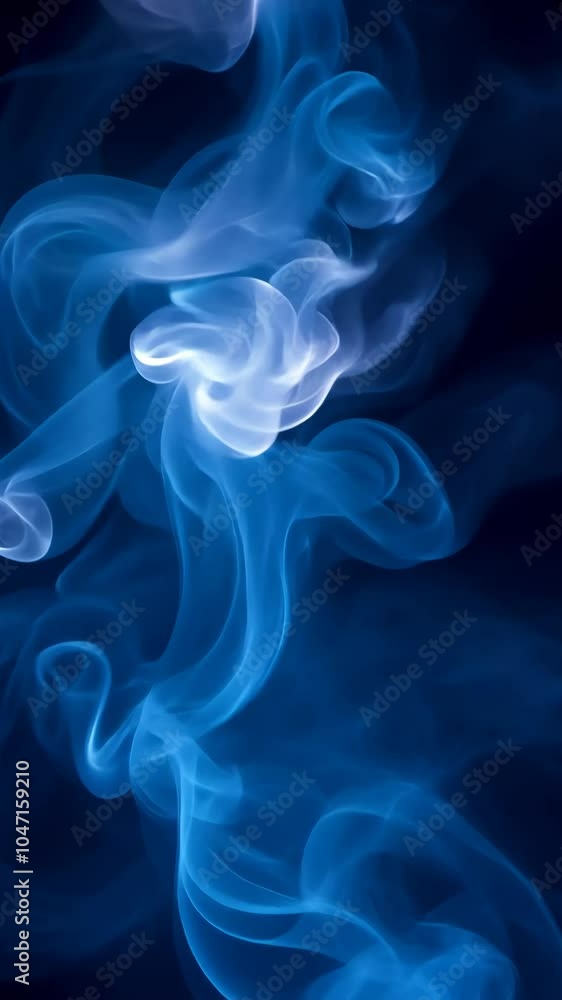 Abstract shapes forming from rising blue smoke against a dark background Abstract shapes forming from rising blue smoke against a dark background