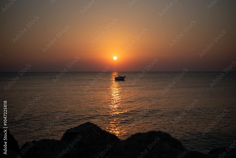 A stunning sunrise over the sea on the island of Crete, Greece. The calm waters reflect the golden hues of the morning sky, creating a peaceful seascape. A stunning sunrise over the sea on the island of Crete, Greece. The calm waters reflect the golden hues of the morning sky, creating a peaceful seascape.