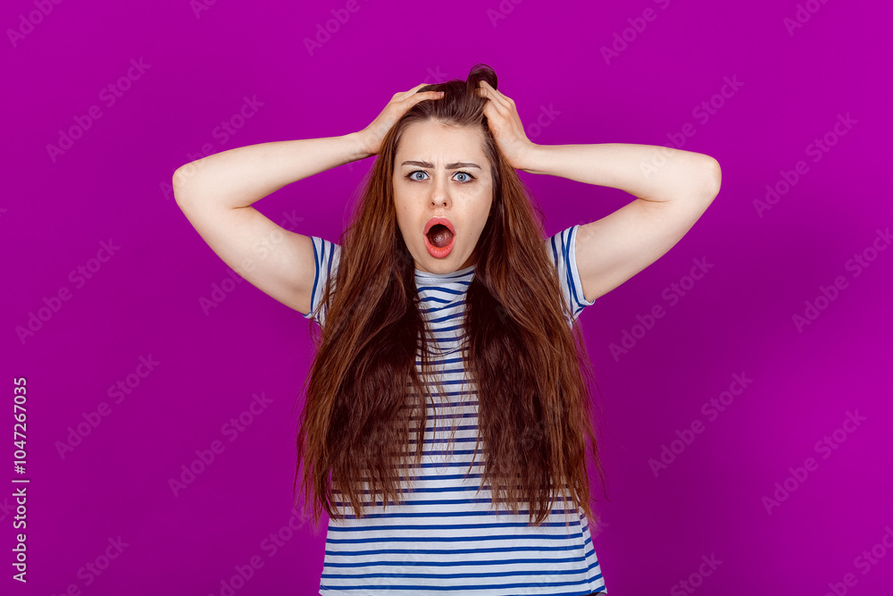 Shocked Young Woman Gripping Her Head and Pulling Hair in Distress and Disbelief. Shock, Surprise, and Emotional Turmoil in Response to Unexpected News or Events Shocked Young Woman Gripping Her Head and Pulling Hair in Distress and Disbelief. Shock, Surprise, and Emotional Turmoil in Response to Unexpected News or Events