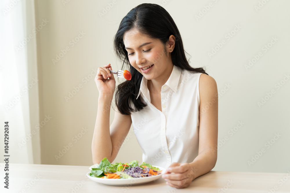 Diet, Dieting asian young woman or girl use fork at broccoli on mix vegetables, green salad bowl, eat food is low fat good health. Nutritionist female, Weight loss for healthy person. Diet, Dieting asian young woman or girl use fork at broccoli on mix vegetables, green salad bowl, eat food is low fat good health. Nutritionist female, Weight loss for healthy person.