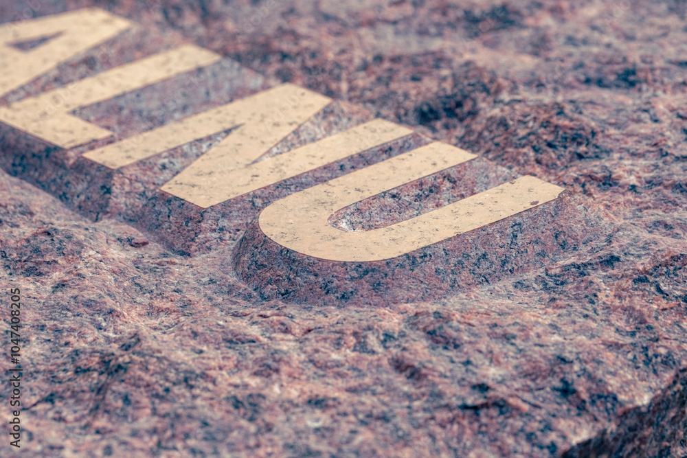 raised relief engraved letters in gravestone made by stone carver ...