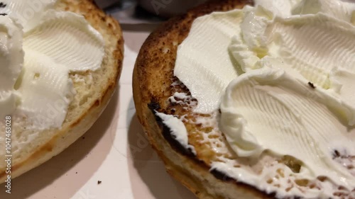 close up of bagle with cream cheese 