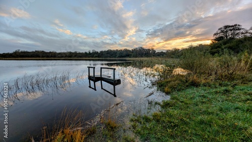 Obraz na płótnie Sunrise lakeside landscape scenery, flooded fishing dock, jetty at Ballyqiurke lough, Moycullen, Galway, Ireland, nature background w salonie