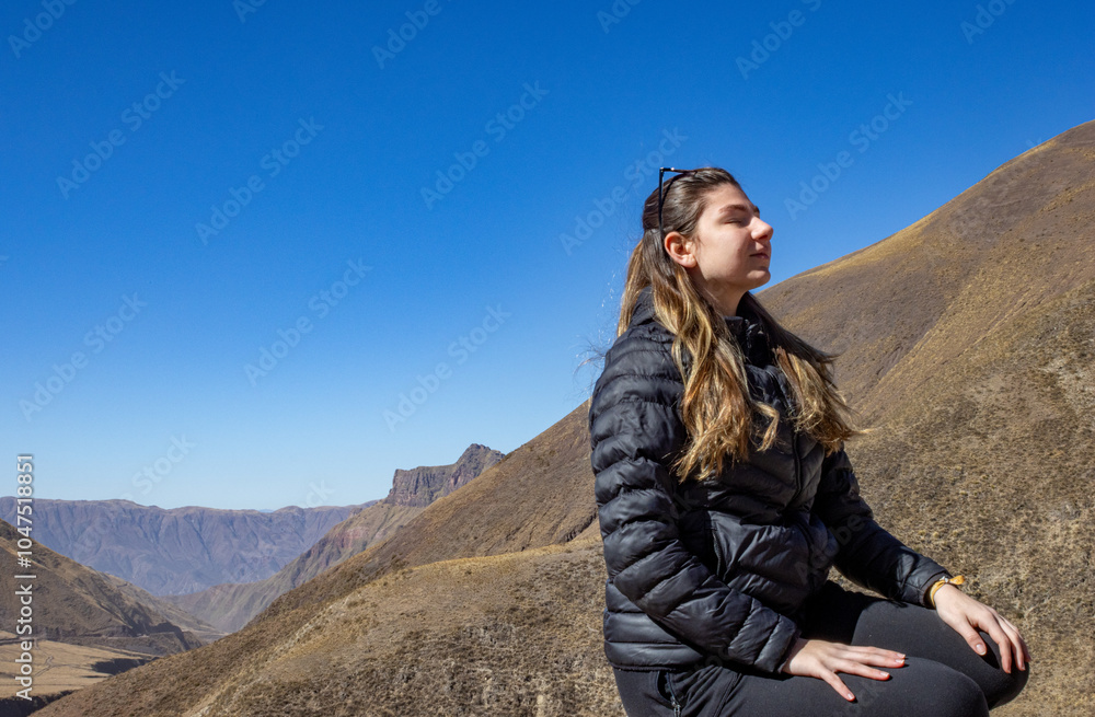 Woman tourist appreciating the mountain scenery in Salta, Arg. Woman tourist appreciating the mountain scenery in Salta, Arg.