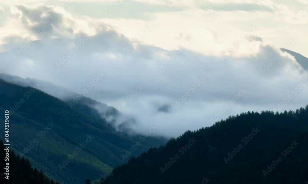 Clouds Rolling Over a Calm Mountain Range Clouds Rolling Over a Calm Mountain Range