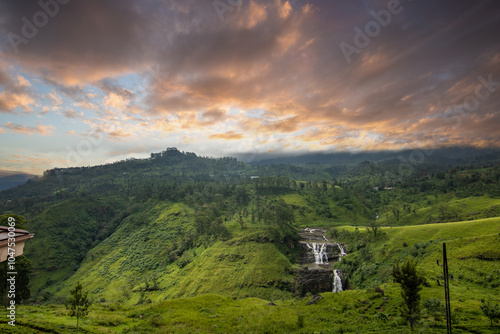 Waterfalls in the highlands, jungle, fields and tea plantations paint the picture in this region. Green landscape shot in cloudy weather between Kandy and Nuwara Eliya, Sri Lanka, Asia photo