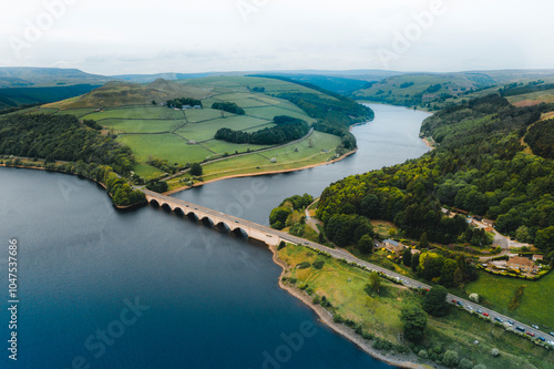 Aerial view wtih beautiful green landscape Derwent Dam, snake road bridge Peak District