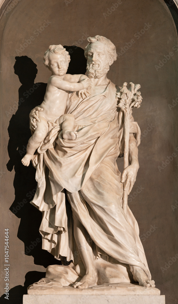 Naklejka premium ALESSANDRIA, ITALY - SEPTEMBER 9, 2024: The marble statue of St. Joseph in the Cathedral by Giacomo Filippo Parodi (1630 – 1702)