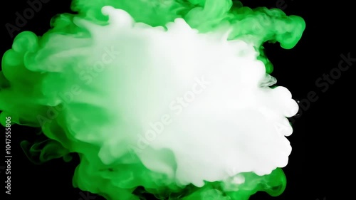 Green ink swirling in white water, creating a mesmerizing cloud-like abstract shape. A mix of colors and motion in water forms a fluid and dynamic image.