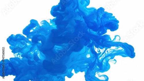 A mesmerizing splash of blue ink spreads and swirls in water, creating a vibrant abstract pattern with rich fluidity and contrast against a white background.