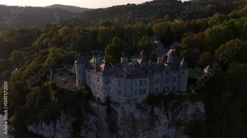 Explore the enchanting Walzin Castle perched above the river in Belgium photo