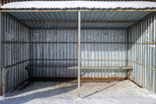 bus stop made of metal profile iron on a clear winter day