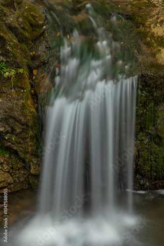 Small waterfall near Jaworki village of Biala Woda creek in autumn day photo