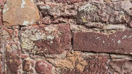 Exploring the Textures and Colors of Ancient Stone Walls in a Historic Location