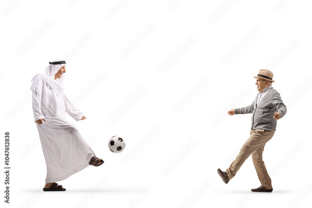 Traditional arab man in ethnic clothes playing football with a senior man Traditional arab man in ethnic clothes playing football with a senior man
