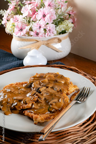 Fototapeta Naklejka Na Ścianę i Meble -  Sauerkraut pancakes /fuczka/ with mushroom sauce .