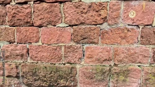 Exploring Vibrant Red Stone Wall Textures in Historical Architecture