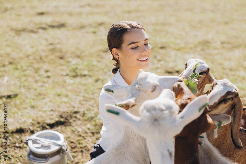 Young Woman Enjoying a Sunny Day Surrounded by Friendly Goats in a Pastoral Farm Setting with Milk Container Nearby Young Woman Enjoying a Sunny Day Surrounded by Friendly Goats in a Pastoral Farm Setting with Milk Container Nearby