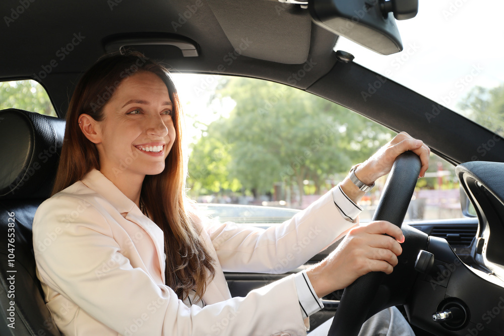 Woman holding steering wheel while driving car Woman holding steering wheel while driving car