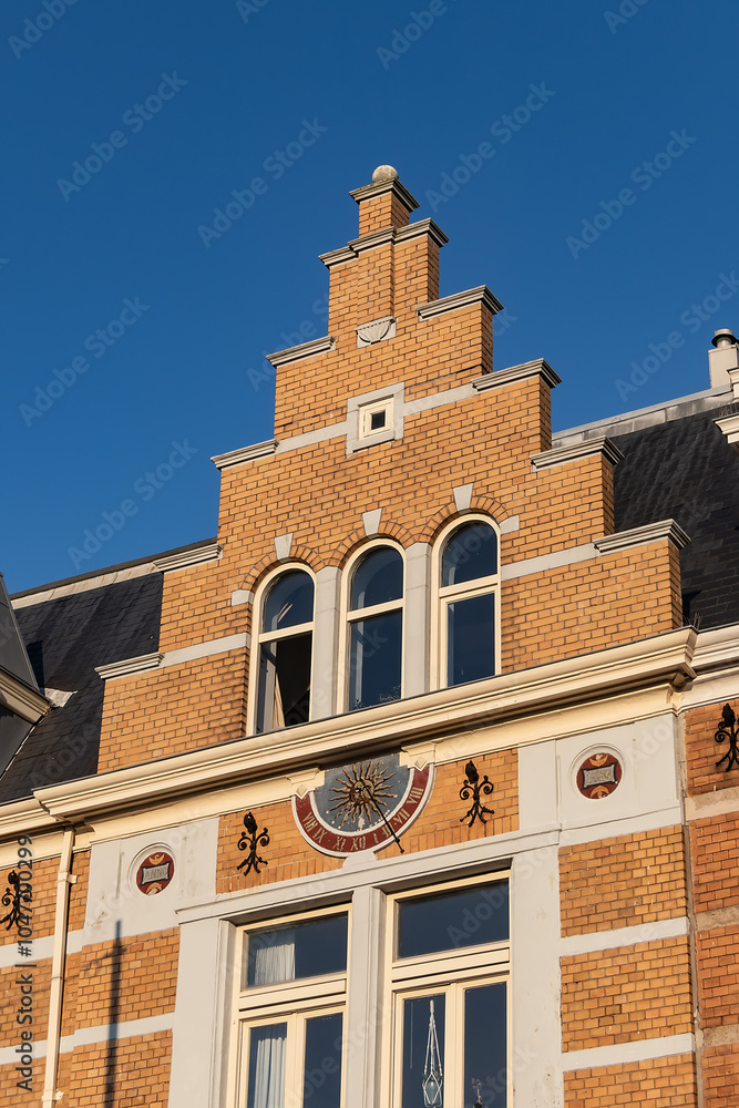 Neo-Renaissance Residential building on Weesperzijde 33k street near Amstel River (1884). Facade is made of yellow German brick, alternating with tuff. Amsterdam, The Netherland. Neo-Renaissance Residential building on Weesperzijde 33k street near Amstel River (1884). Facade is made of yellow German brick, alternating with tuff. Amsterdam, The Netherland.