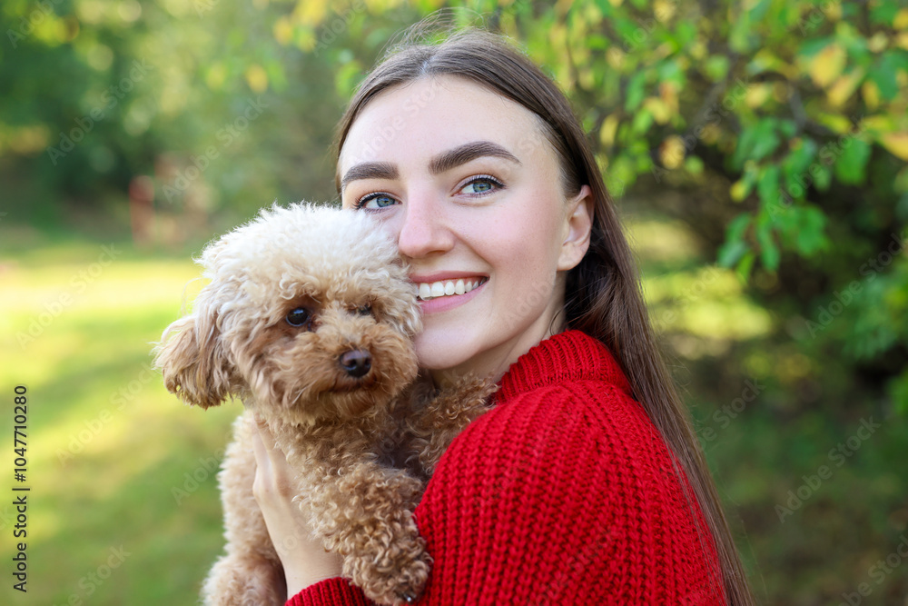 Smiling woman with cute dog in autumn park Smiling woman with cute dog in autumn park