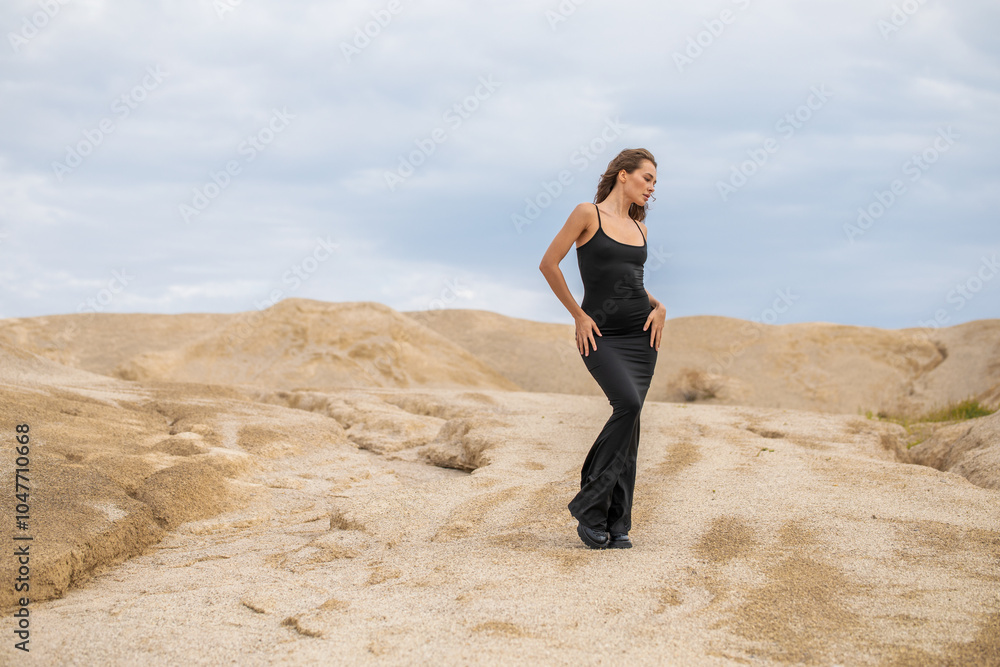 Fashion portrait of a young beautiful model in black dress Fashion portrait of a young beautiful model in black dress