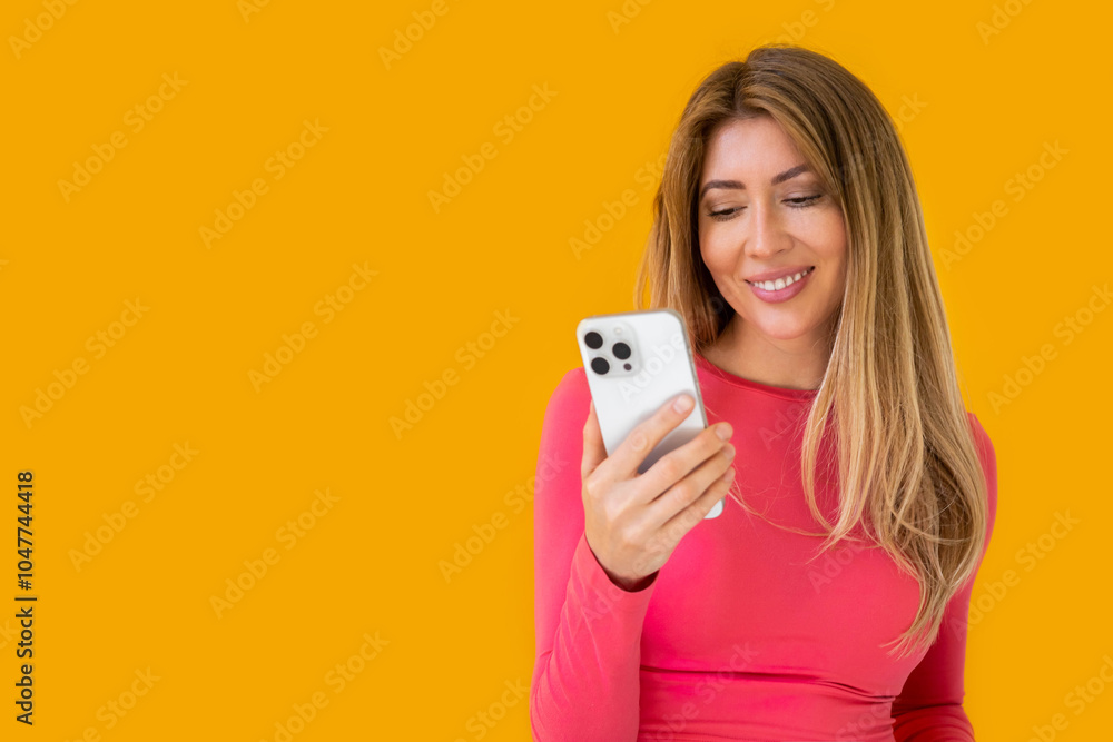 Portrait of a young Caucasian woman with pleasant smile isolated on yellow wall with copy space. Portrait of a young Caucasian woman with pleasant smile isolated on yellow wall with copy space.