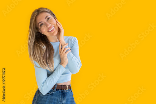 Portrait of a young pensive and dreaming Caucasian woman with pleasant smile isolated 