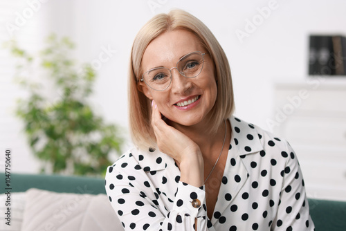 Portrait of smiling middle aged woman at home Free Download Portrait of smiling middle aged woman at home - GFXLoad