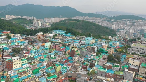 Wallpaper Mural BUSAN, SOUTH KOREA - OCTOBER 20, 2024: Aerial view of vibrant Gamcheon Culture Village showcasing colorful houses and breathtaking hills Torontodigital.ca