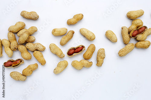 Roasted peanuts in shell on white background.