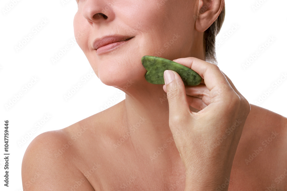 Woman doing facial massage with gua sha tool on white background, closeup Woman doing facial massage with gua sha tool on white background, closeup