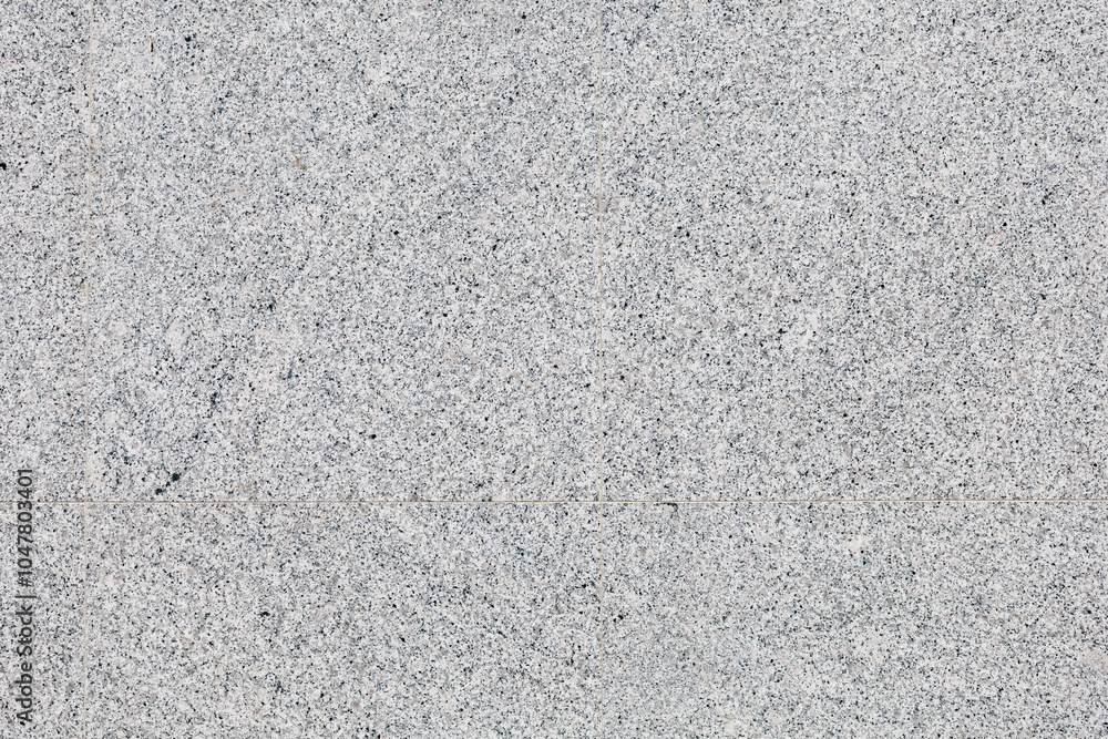 A gray tile floor with a pattern of small squares A gray tile floor with a pattern of small squares