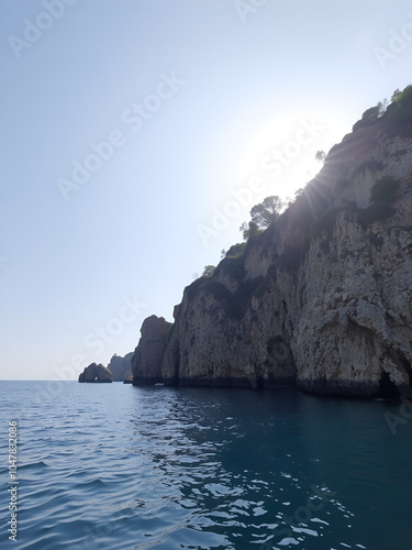 Vacanze in Calabria con mare e ragazza seduta sull'altalena photo