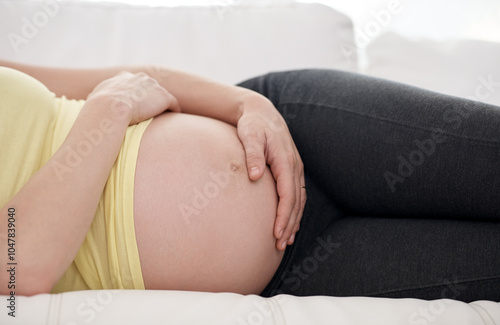 Relax, belly and pregnant woman on sofa in home for bonding, rest and prenatal connection. Health, wellness and female person holding pregnancy stomach for maternity break in living room at house.