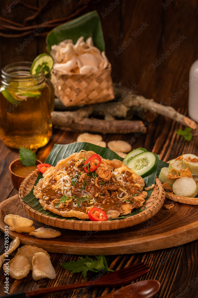 Tahu tek egg with chips or cracker, cucumber and petis sauce on aesthetic background. Tahu tek comes from Surabaya, an authentic Indonesian food., Tahu tek egg with chips or cracker, cucumber and petis sauce on aesthetic background. Tahu tek comes from Surabaya, an authentic Indonesian food.,