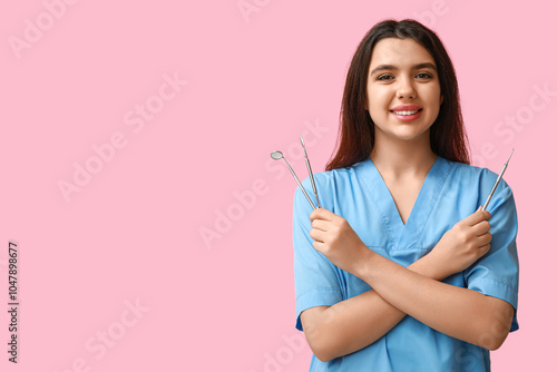Female dentist with tools o...