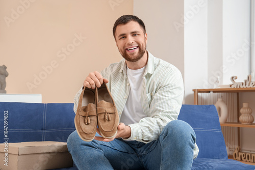 Man holding pair of stylish...